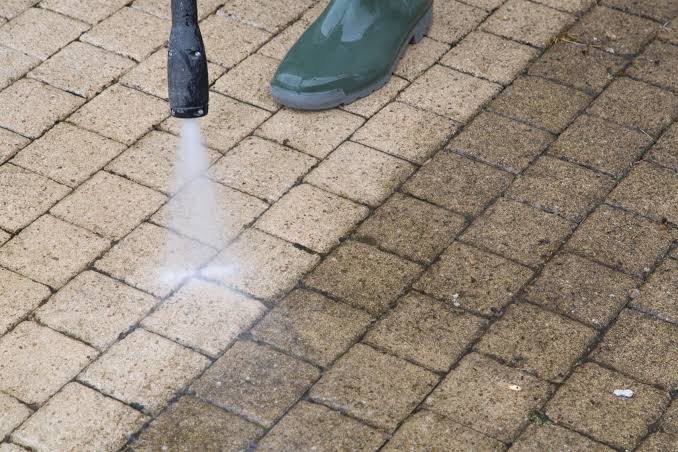 Paver patio being cleaned and restored