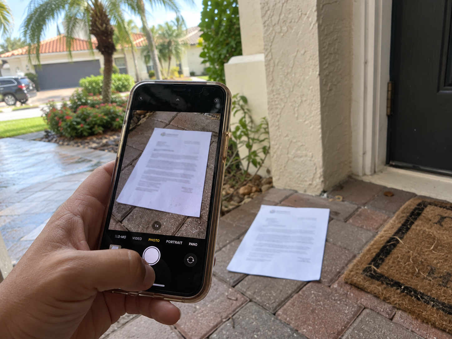 Illustration of a homeowner photographing a notice at a Florida doorstep